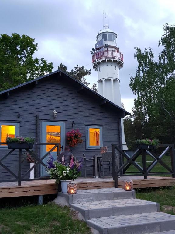 Cabin by the lighthouse at dusk